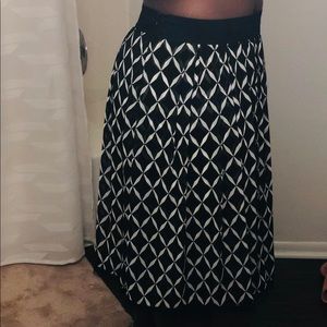 Long skirt - sits below the knee—- about 28” long